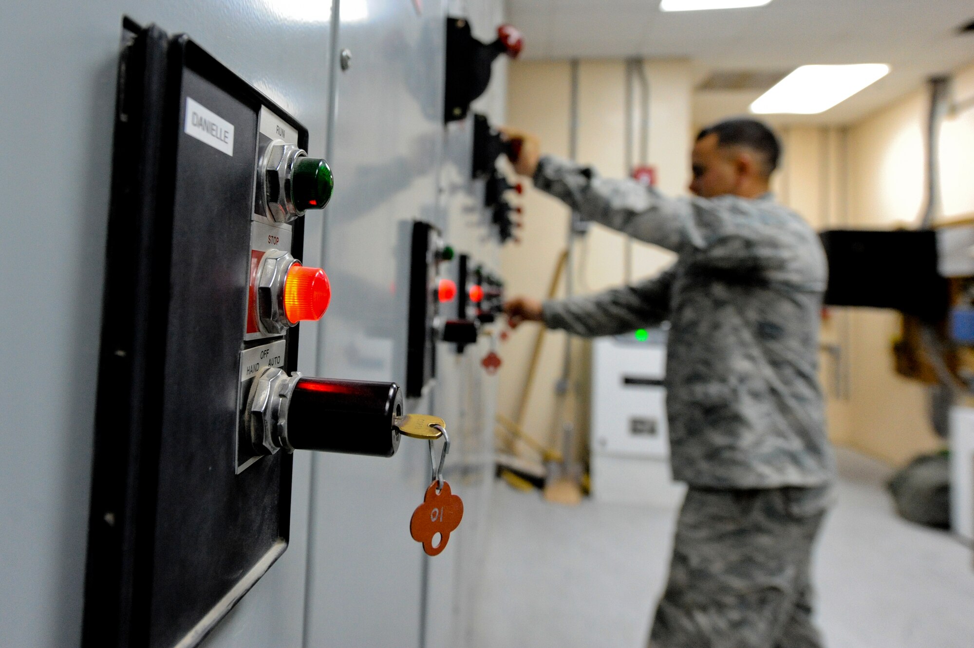 U.S. Air Force Staff Sgt. Ryan Lewis-Turk, 380th Expeditionary Logistic Readiness Squadron fuel storage supervisor, turns on a circuit breaker to fuel pumps at an undisclosed location in Southwest Asia August 7, 2013. Lewis-Turk monitors the fuel pump system used to refuel aircraft on the flightline. Lewis-Turk is native to Phoenix, Ariz., and is deployed from Eielson Air Force Base, Alaska. (U.S. Air Force photo by Staff Sgt. Joshua J. Garcia)