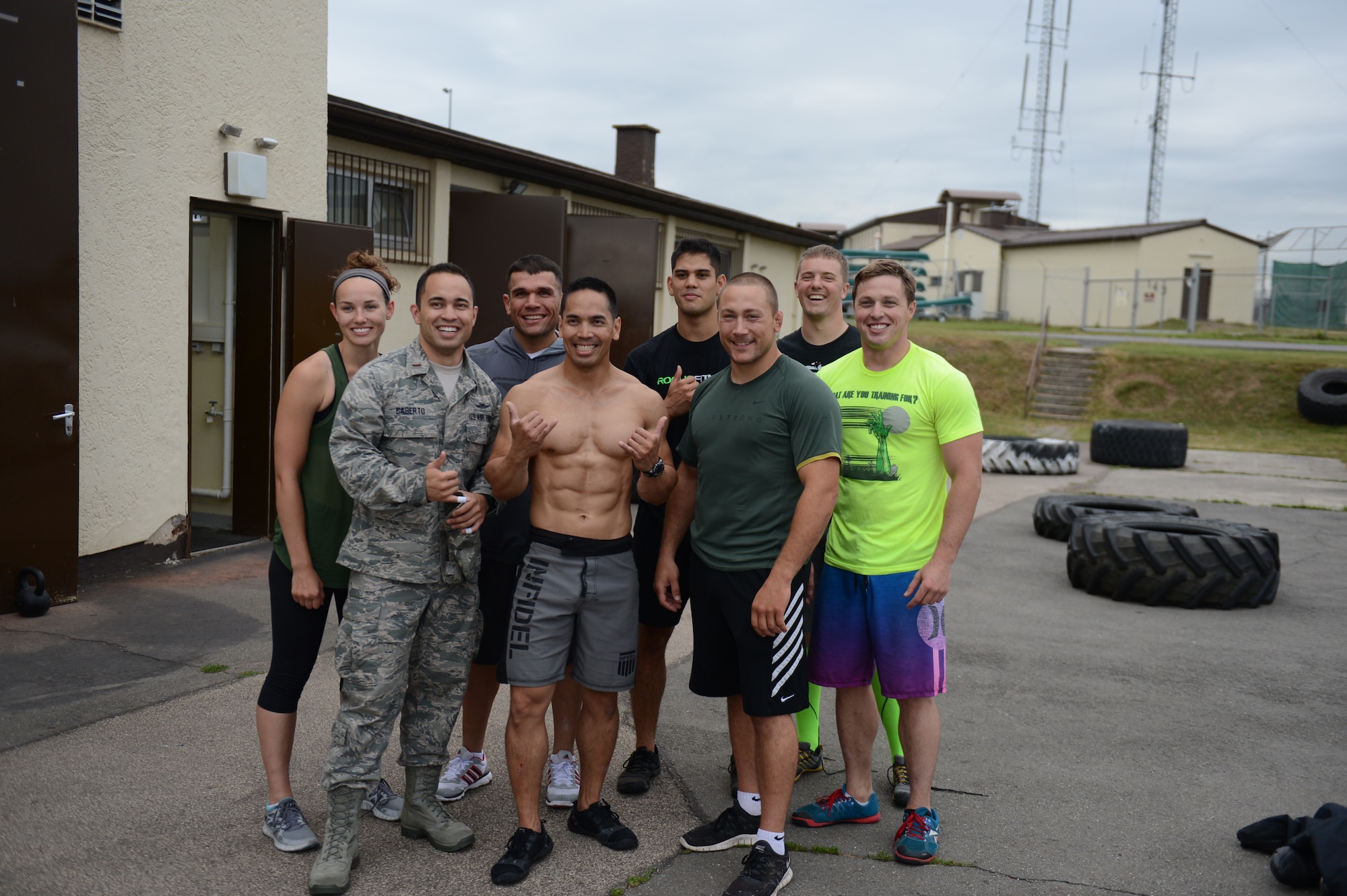 SPANGDAHLEM AIR BASE, Germany – Airmen from Spangdahlem AB pose with Ultimate Fighting Championship fighters Michael Pierce and Edgar Mendez after a combat fitness workout at the fitness assessment cell Aug. 8, 2013. The visit will last until Aug. 10, where the fighters will join Airmen for a televised UFC fight viewing inside Club Eifel. (U.S. Air Force photo by Airman 1st Class Gustavo Castillo/Released)