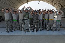 KUNSAN AIR BASE, Republic of Korea – Colonel S. Clinton Hinote, 8th Fighter Wing commander and Republic of Korea air force, Col. Min-Oh Seo, 38th Fighter Group commander, take a moment during exercise Beverly Midnight 13-3, Aug. 8, 2013 to “crush’em” with 80th Fighter Squadron crew chiefs. The commanders visited with 8th Security Forces Squadron and flight line personnel during the exercise to give accolades and answer questions. (U.S. Air Force photo by Staff Sgt. Tong Duong/Released)