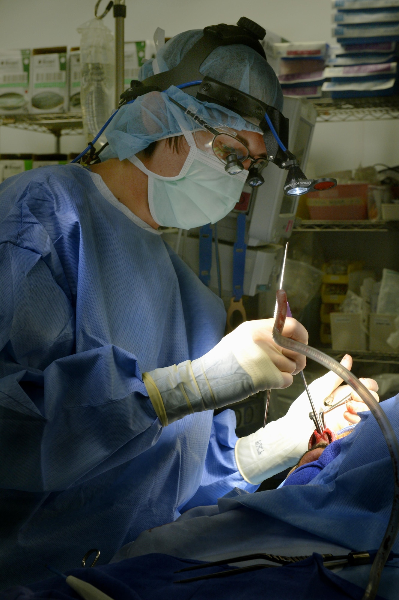 Major Jamie Swartz, an ear nose and throat surgeon, performs an open septorhinoplasty on a patient in the Craig Joint Theater Hospital on Bagram Airfield, Afghanistan, July 22, 2013. The procedure performed separated his nose into a left and right side straightening the septum and bones, reducing the obstruction and allowing the patient to breathe better. The patient had problems breathing, headaches and pressure because of an obstruction inside his nose. Swartz is assigned to the 455th Expeditionary Medical Group and deployed from Langley Air Force Base, Va.  (U.S. Air Force photo/Staff Sgt. Stephenie Wade)