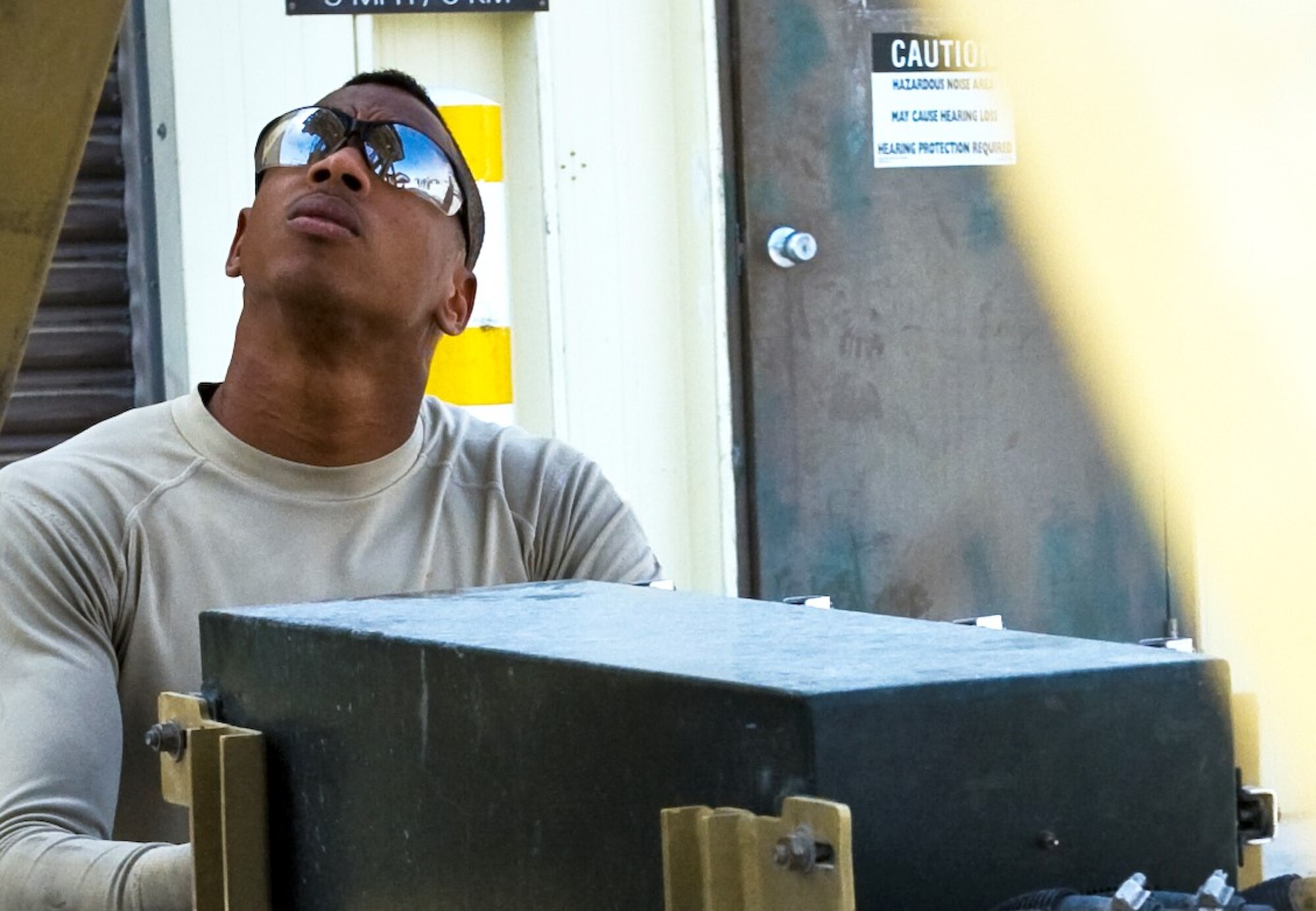 Senior Airman Maurice Kelly performs routine maintenance on a Tunner 60K aircraft cargo loader at the 379th Air Expeditionary Wing July 31, 2013, in Southwest Asia. Kelly is a 379th Expeditionary Logistics Readiness Squadron material handling and equipment mechanic deployed from Seymour Johnson Air Force Base, N.C.