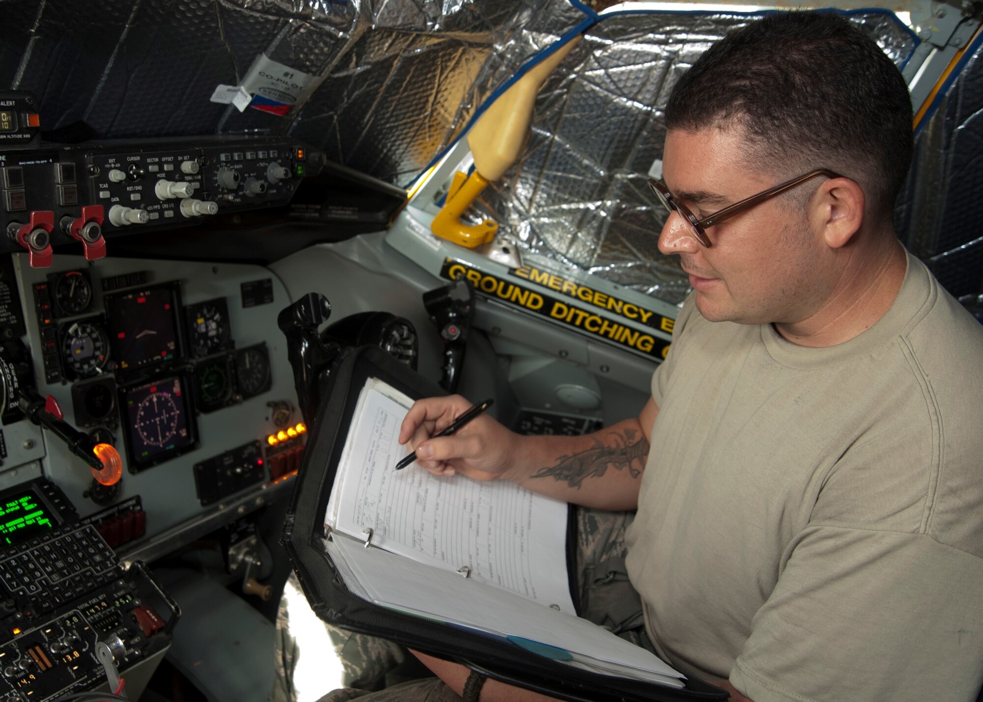 Senior Airman Zachary Kizer performs a system check on a KC-135 Stratotanker at the 379th Air Expeditionary Wing Aug. 7, 2013, in Southwest Asia. The cooling sock attachment created by the 379th Expeditionary Operations Support Squadron aircrew flight equipment shop improves airflow in the flight deck not only benefiting aircrews and maintainers, but also the circuit boards, which prevents power outages. Kizer is a 340th Expeditionary Aircraft Maintenance Unit instrument and flight control systems technician.