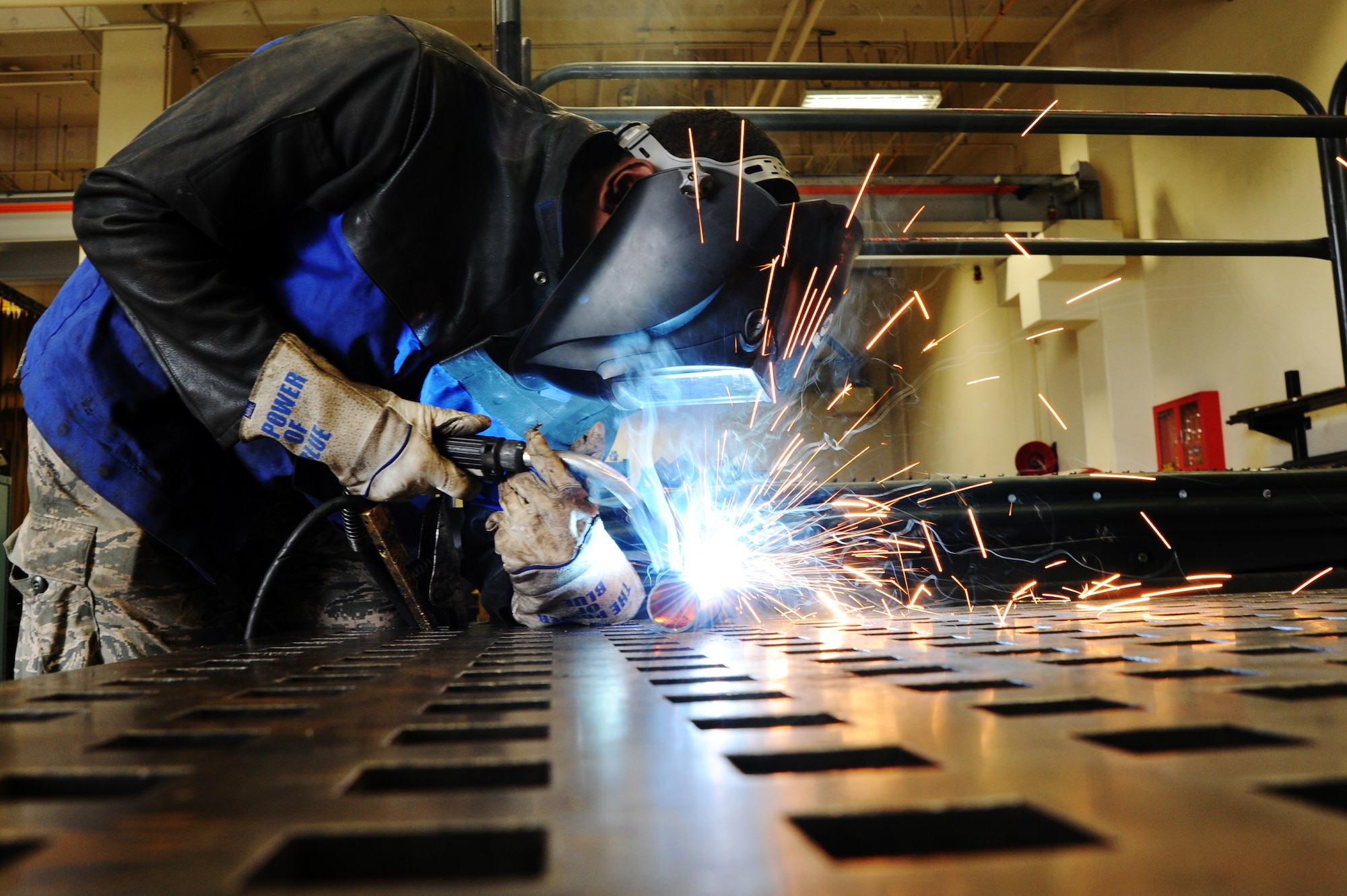 U.S. Air Force Airman 1st Class Jonathan Brown, 35th Maintenance Squadron, welds parts of an F-16 Fighting Falcon at Misawa Air Base, Japan, Aug. 8, 2013. Brown is a metals technologist who specializes in machine welding and part fabrication. (U.S. Air Force photo/Senior Airman Derek VanHorn)