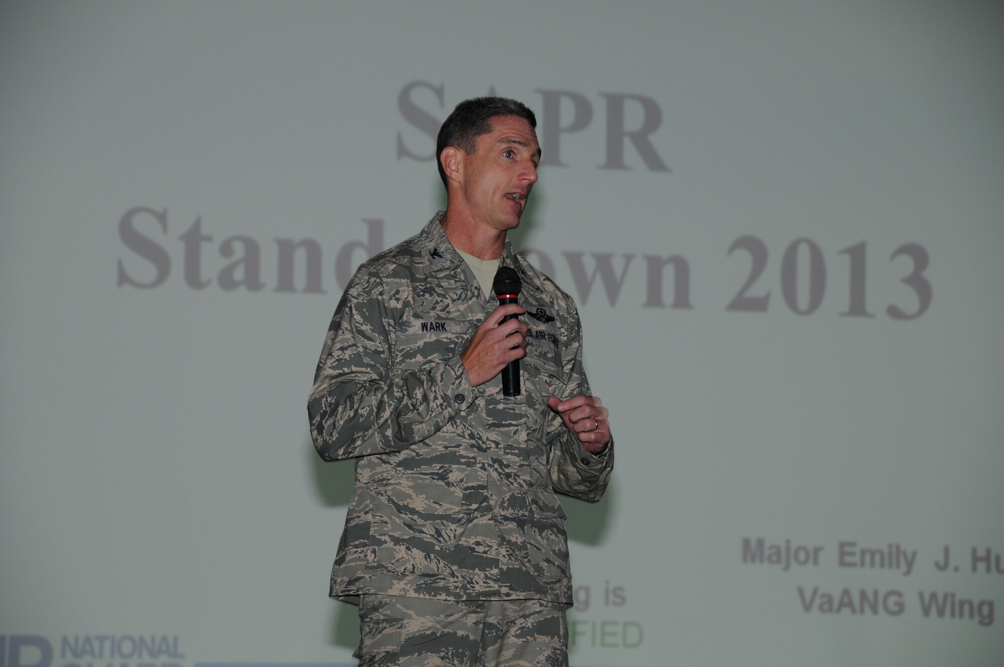 Col. Keith Wark, 192nd Fighter Wing Commander, briefs airmen from the unit during the Sexual Assault Prevention & Response Stand-Down Program, August 11, 2013. The SAPR Program is designed to address sexual assault in the military and provides tools and resources for service members to use if an incident occurs. (U.S. Air National Guard photo by Master Sgt. Carlos J. Claudio/Released)