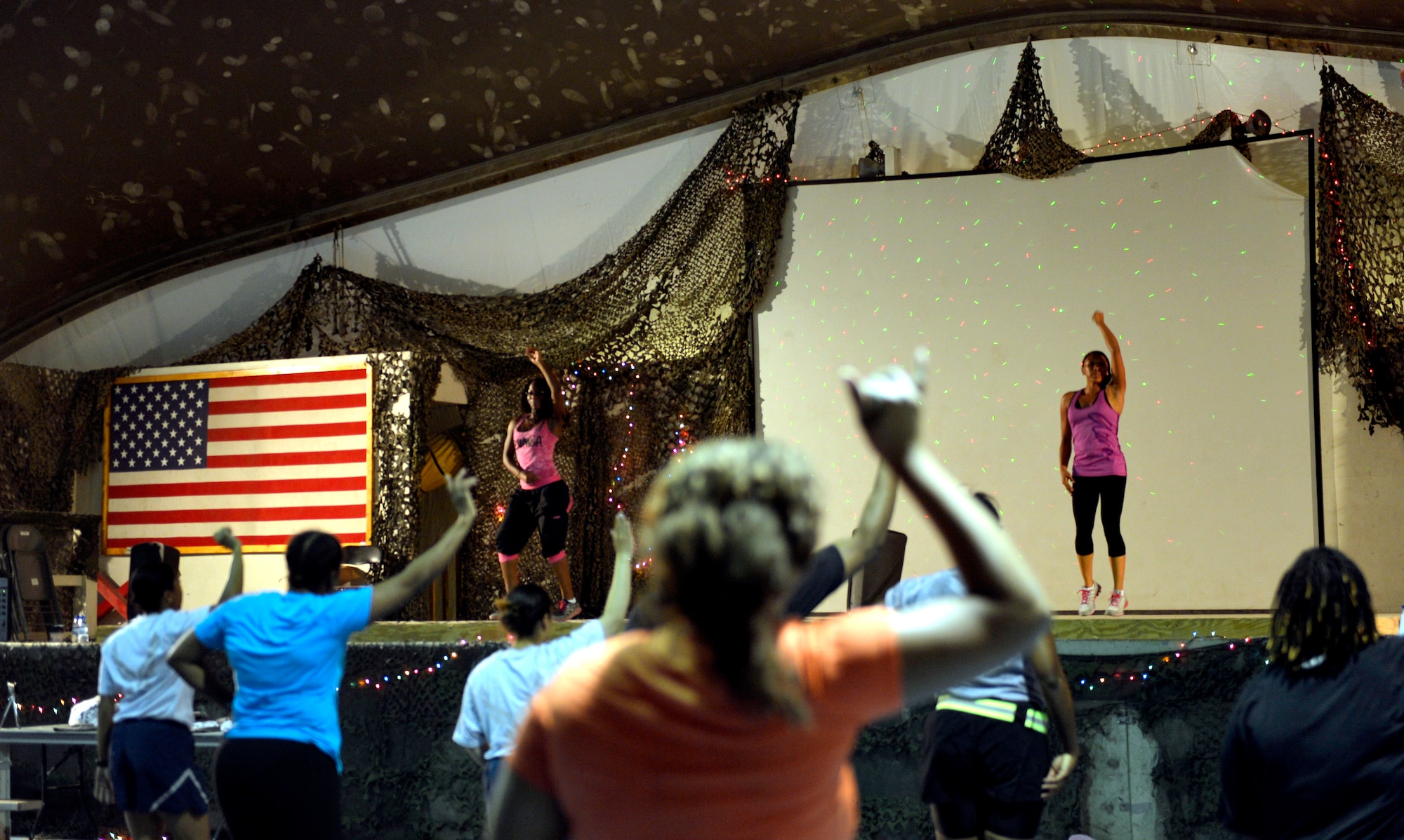 More than 30 participants took part in a Zumba dance fitness class here Aug. 10, 2013. Zumba classes are held in the Clamshell gym each Monday, Wednesday and Friday from 8 – 9 p.m. (U.S. Air Force photo/Staff Sgt. Stephenie Wade) 