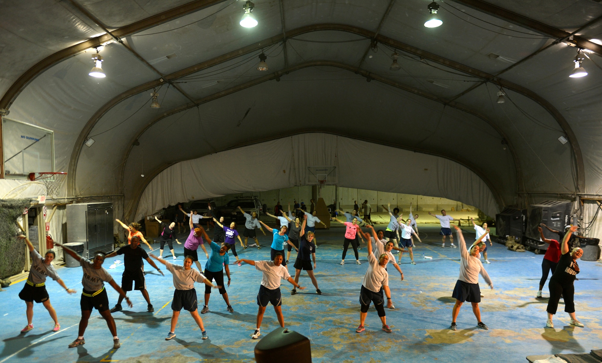 More than 30 participants took part in a Zumba dance fitness class here Aug. 10, 2013. Zumba classes are held in the Clamshell gym each Monday, Wednesday and Friday from 8 – 9 p.m. (U.S. Air Force photo/Staff Sgt. Stephenie Wade) 