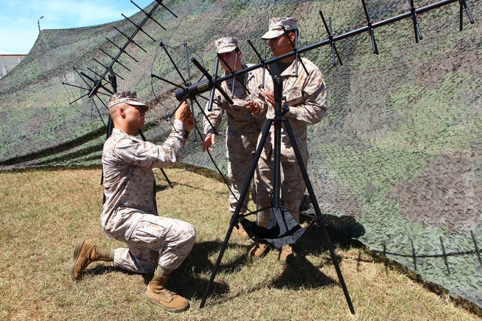 Marines with Combat Logistics Regiment 3  assemble a satellite communications antenna July 26 at Camp Foster during a communication exercise. During the exercise, the Marines conducted a variety of communication capabilities training to include setting up a radio section, data section and establishing telephone services. The exercise benefited the Marines by preparing them to maintain and enhance their capabilities to support a 
military response to any contingencies that may occur in the Asia-Pacific region. The Marines are field radio operators with CLR 3, 3rd Marine Logistics Group, III Marine Expeditionary Force.
