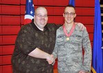 Staff Sgt. Josh Blankley with Ronald Alberding at the March 9, 2013, award ceremony for Blankley.