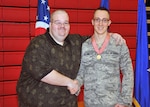 Staff Sgt. Josh Blankley with Ronald Alberding at the March 9, 2013, award ceremony for Blankley.