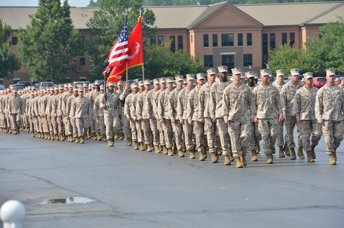 Officer Candidates School’s Charlie Co. candidates march on the parade deck during their graduation ceremony at OCS aboard Marine Corps Base Quantico Aug. 9. More than 150 candidates graduated that day.