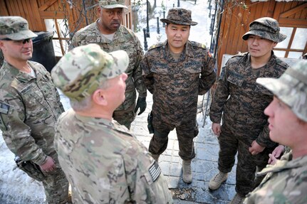 Army Gen. Frank Grass, the chief of the National Guard Bureau, talks with Mongolian soldiers serving in Afghanistan, Jan. 15, 2013. Mongolia is partnered with Alaska in the National Guard State Partnership Program. 