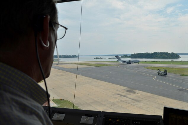Wayne Wimsett, air traffic controller for the Marine Corps Air Facility, Marine Corps Base Quantico, watches a C-17 Globemaster III transport airplane land on the airstrip on July 31, 2013. MCAF maintains one of the most complex airspaces in the Marine Corps.