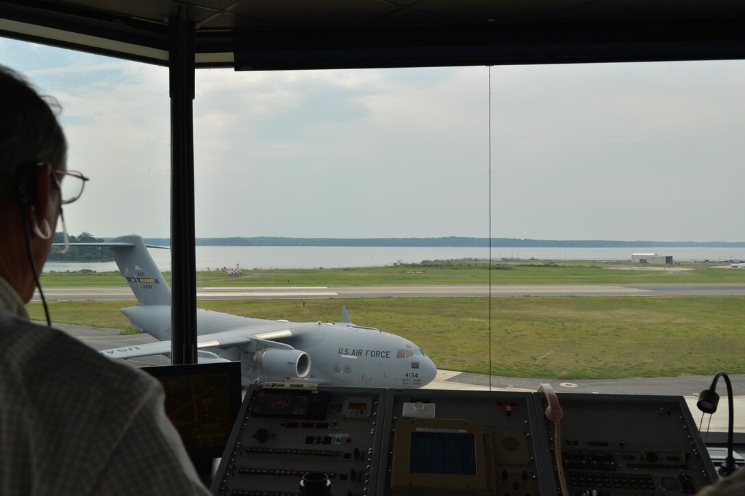 Wayne Wimsett, air traffic controller for Marine Corps Air Facility Quantico, watches as a C-17 Globemaster III cargo airplane taxis into loading position on July 31, 2013. MCAF maintains one of the most complex airspaces in the Marine Corps, including two military operation airspaces, a restricted airspace and a Special Flight Rules Airspace. 