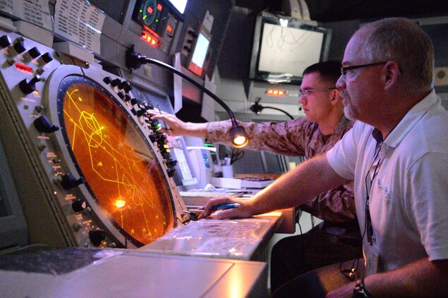 David Crawford, air traffic controller specialist for Marine Corps Air Facility Quantico,  carefully observes local air traffic in the radar room on July 31, 2013. MCAF maintains one of the most complex airspaces in the Marine Corps, including two military operation airspaces, a restricted airspace and a Special Flight Rules Airspace.