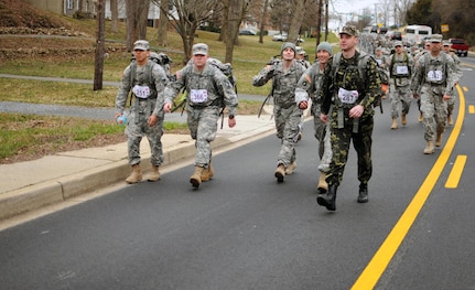 Participants in the Norwegian Foot March challenge in La Plata, Md., March 16, 2013, smile and show esprit de corps at the beginning stages of the 30-kilometer event.