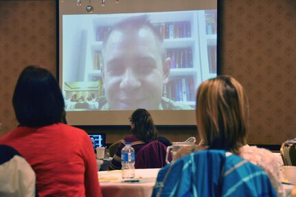 Capt. Matthew Mangerson discusses the welfare of the Wisconsin Army National Guard's Battery B, 1st Battalion, 121st Field Artillery from Afghanistan via Skype during a Badger Yellow Ribbon event March 24, 2013, at The Osthoff Resort in Elkhart Lake, Wis.