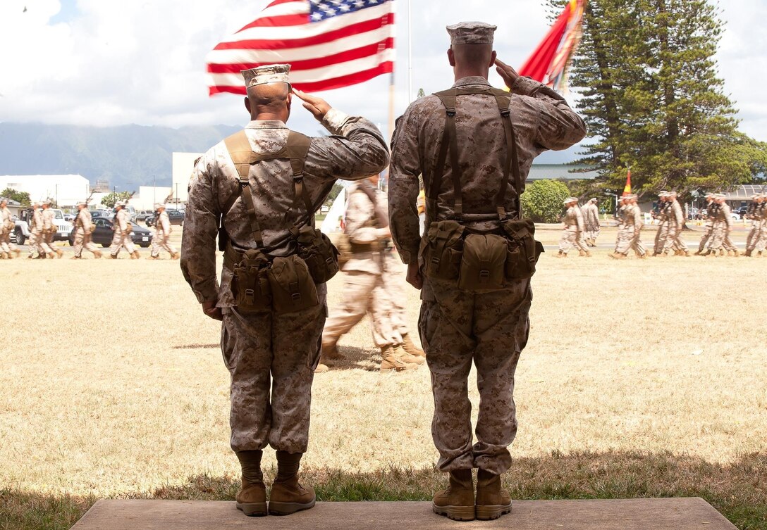 Sergeants Maj. Steven Collier (left) and Scott Stutler (right) salute colors during pass in review for 2nd Battalion, 3rd Marine Regiment’s Post and Relief Ceremony at Dewey Square, Aug. 8, 2013. During the ceremony, Sgt Maj. Stutler took the duties and responsibilities of battalion sergeant major from Collier. Collier is scheduled to report to Headquarters Battalion, later this month. “Sgt. Maj. Collier was always leading from the front,” said Lt. Col. James Conway, commanding officer, 2nd Bn., 3rd Marines. “This man is going to be in front of his Marines no matter what, whether it’s doing night attacks up a snow-covered mountain, living in a snow cave, or riding on those white rocket skis they gave us,” Conway said of Collier during mountain training. “He’s been an inspirational leader, provided sound guidance to all the senior staff non-commissioned officers and officers in the battalion and we’ve really come to appreciate his steady, firm and fair leadership.” (U.S. Marine Corps photo by Cpl. Matthew Callahan)