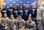 Kahlil, Karon, Kameron and Karlyle Jones pose with family and friends after their enlistment March 7, 2013, at Fort Lee, Va. Sgt. Brian Merritt (far right) was their recruiter.