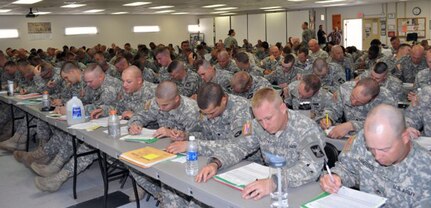 Soldiers from the 182nd Engineer Battalion attend the Veteran's Opportunity to Work/Transition Assistance Program training during the demobilization process at the Soldier Readiness Processing site at Fort Bliss, Texas, Jan. 23, 2013.