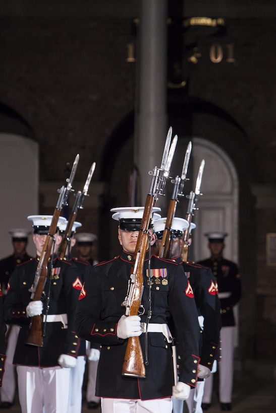 Marine Corps Silent Drill Platoon members perform during a Friday Evening Parade at Marine Barracks Washington, D.C., Aug. 3. 