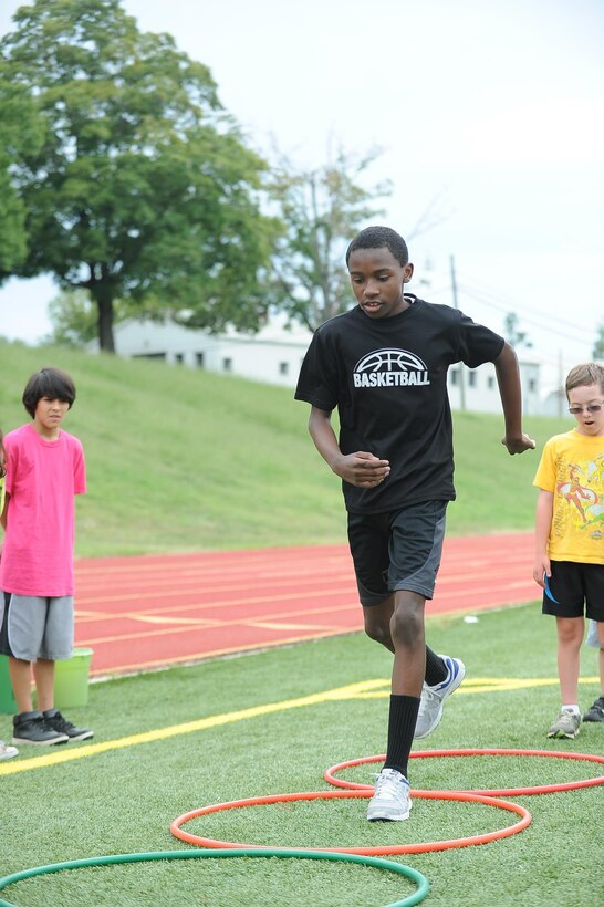 Justin,14, practices the triple jump challenge at the Butler Stadium on Marine Corps Base Quantico on Aug. 3, 2013, during a practice session for the Special Olympic Track and Field Meet, which is scheduled for Sept. 7. 