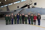 A delegation from Vietnam joins Oregon National Guard leadership for a photo in front of an F-15 Eagle during a visit to the Oregon Air National Guard’s 142nd Fighter Wing at the Portland Air National Guard Base, April 15, 2013.