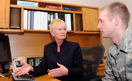 Dawn Hemming-Rich, 28th Force Support Squadron Education Office education and training section chief, explains the process for transferring Post 9/11 GI Bill benefits to family members to Staff Sgt. Keith Smith at Ellsworth Air Force Base, S.D., Jan. 24, 2013.