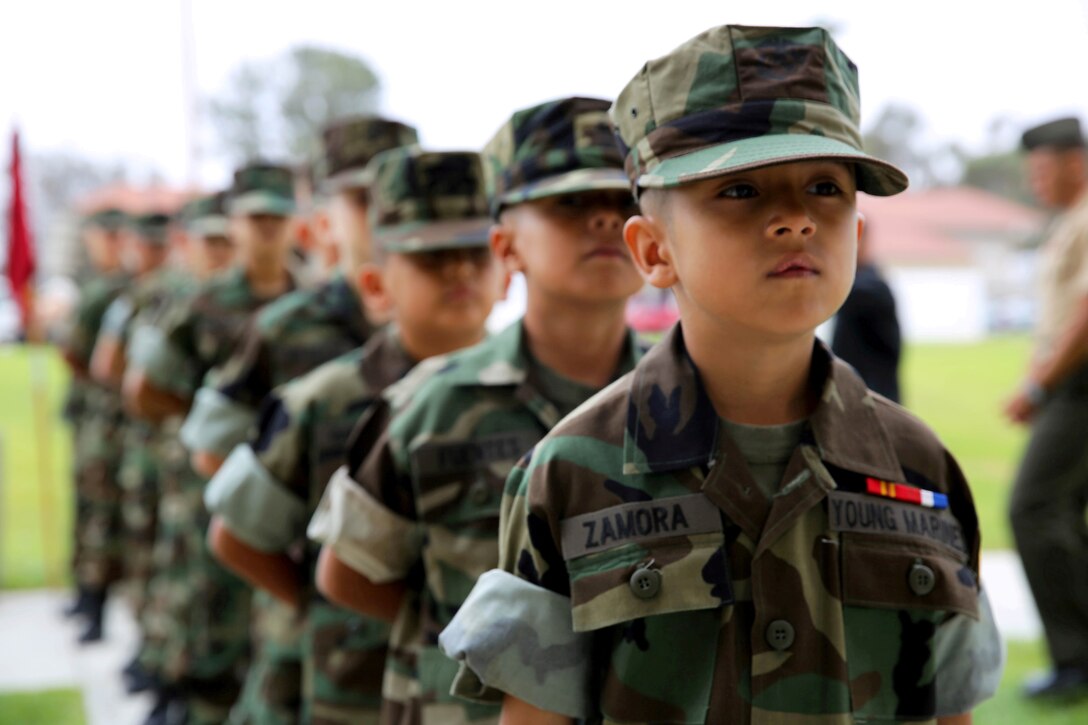 Eagle Young Marines form up in a column in preparation for their graduation ceremony held at the base theater here August 10. The Eagle Young Marines of the Marine Corps League is a non-profit youth organization dedicated to drug demand reduction, academics, and community service.