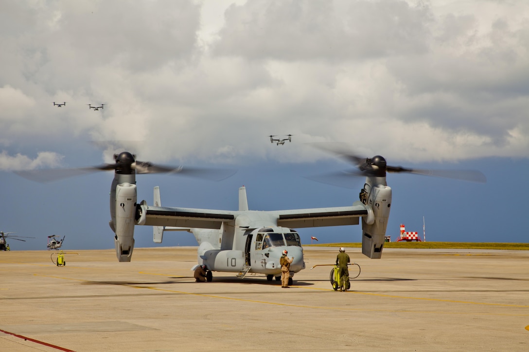 MV-22B Ospreys land at Marine Corps Air Station Futenma Aug. 12 after flying from Marine Corps Air Station Iwakuni. The tiltrotor aircraft combines the vertical capability of a helicopter with the speed and range of a fixed-wing aircraft, enabling it to fly twice as fast, carry three times as much, and fly four times the distanceof the older CH-46E helicopter it is replacing. The Ospreys are with Marine Medium Helicopter Squadron 262, Marine Aircraft Group 36, 1st Marine Aircraft Wing, III Marine Expeditionary Force. (U.S. Marine Corps photo by Lance Cpl. Stephen Himes/Released)