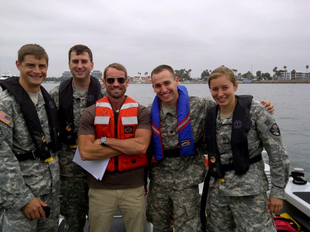 (From left to right) Cpt. Daniel Feldpausch, 1st Lt. Sean Peterson, and Jeff Cole, all project managers assigned to the Los Angeles District, pose for a photo with Cadets Chris Lillie and Mackenzie Vaughn, at the site of a future project in Marina Del Rey, during the cadets' three-week internship.