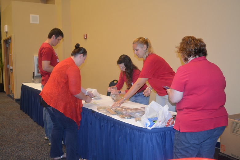 Volunteers (left to right) Alex Schur, Pam Winant, Stephanie Raulerson, Viktoria Bogina and Susan Copeland prepare materials for student challenges at the Second Annual STEM Camp held at the University of North Florida. 