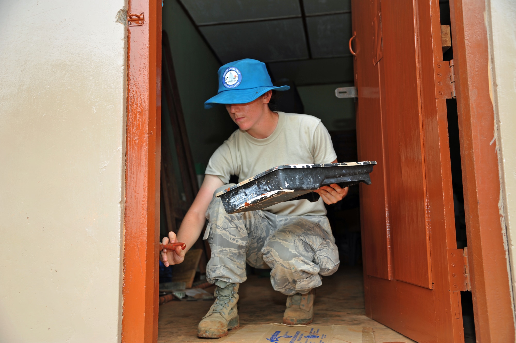 JAFFNA, Sri Lanka – 1st Lt. Renee Kittka, 354th Civil Engineering Squadron, Eielson Air Force Base, Alaska, paints a window during Operation Pacific Angel 13-4 in Jaffna, Sri Lanka, Aug. 6. More than 50 Air Force, Army, Marine Corp and Navy personnel are in Jaffna on a humanitarian mission to refurbish schools and provide medical care to Sri Lankans during PACANGEL 13-4. (U.S. Air Force photo/ Master Sgt. Kerry Jackson)
