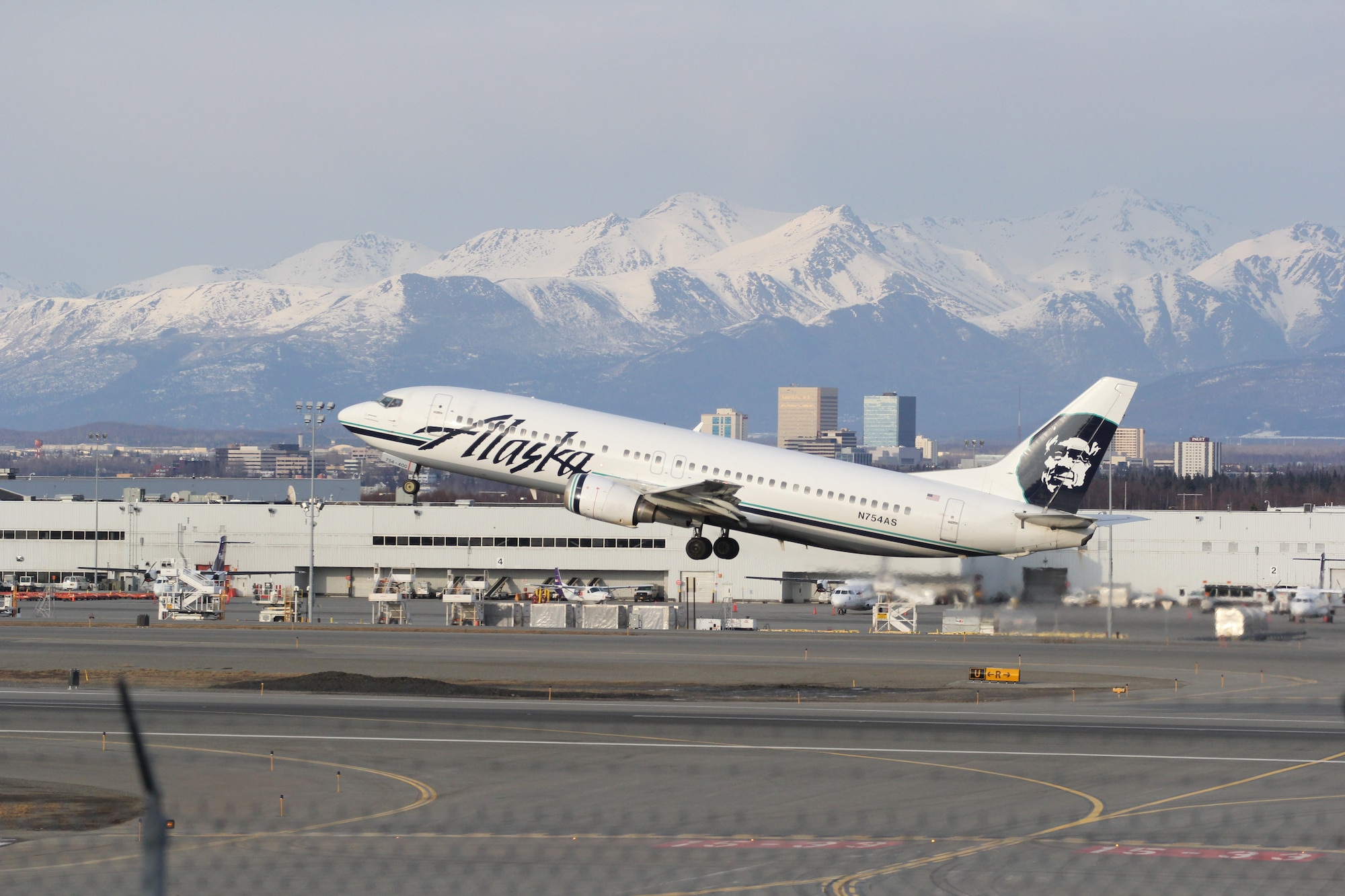 An Alaska Airlines plane takes off from Ted Stevens International Airport April 29. Maj. Wade Bridges splits his time between flying the F-22 for Alaska’s only Air Force Reserve unit and a Boeing 737 for Alaska Airlines (U.S. Air Force/Tech. Sgt. Dana Rosso) 