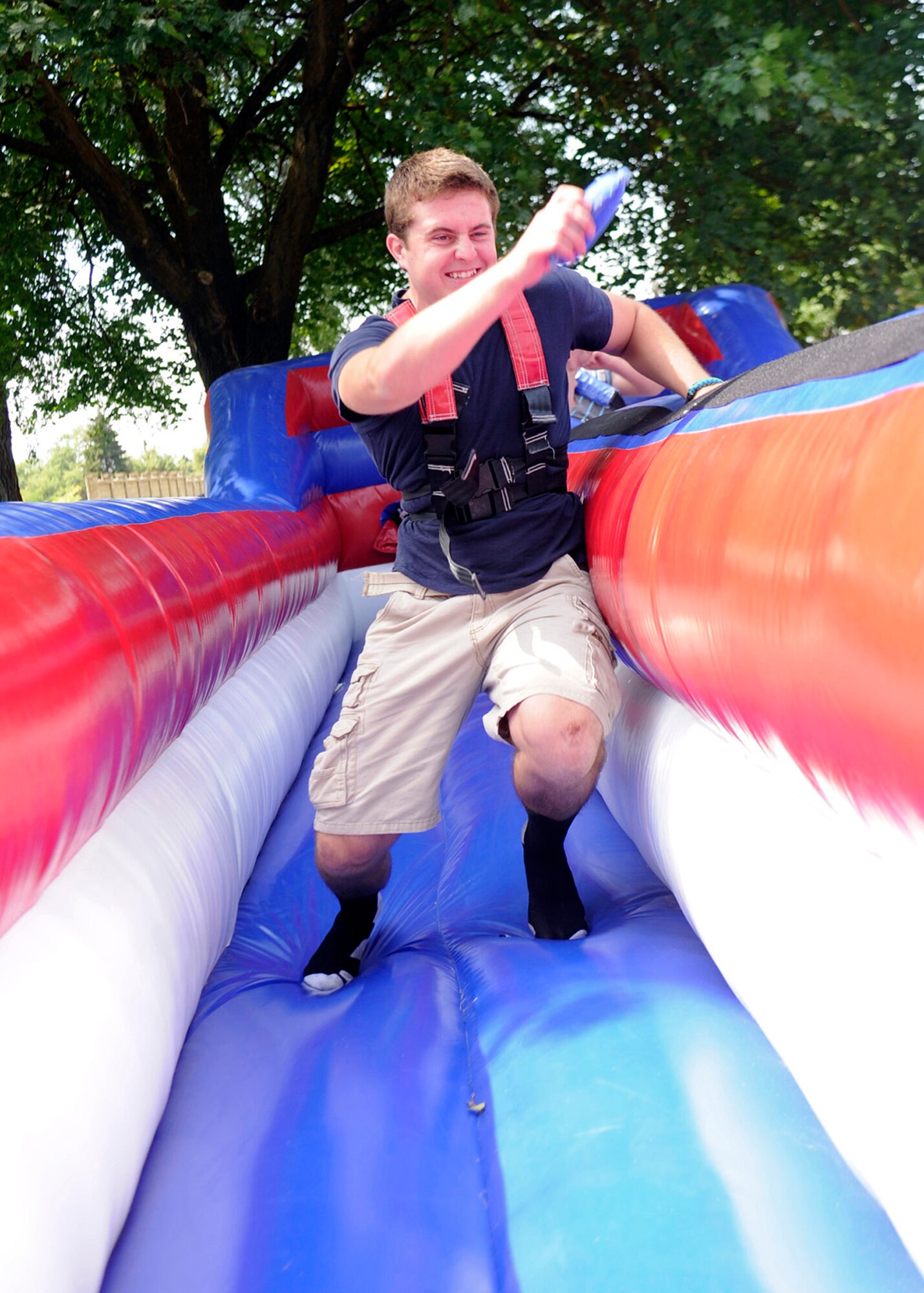 Curtis Boal uses the bungee run during the base picnic at Fairchild Air Force Base, Wash., Aug. 9, 2013. The picnic held many other activities such as face painting, airbrush tattoos, a bungee trampoline and a rock wall. (U.S. Air Force photo by Senior Airman Taylor Curry/Released)