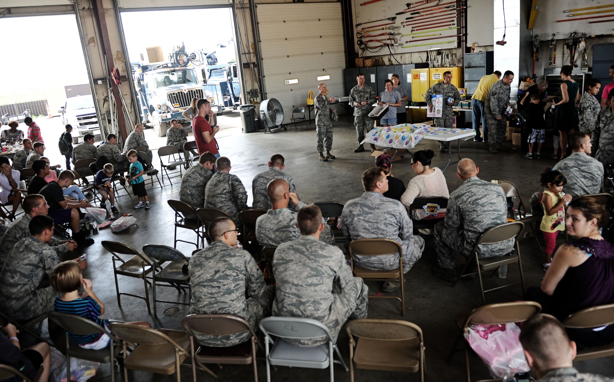 Members of the 375th Civil Engineer Squadron takes items that was donated by Operations Heroes Aug. 9, 2013 at Scott Air Force Base, Ill.  Operation Hero donated clothes, school supplies, diapers, bookbags, and other baby items. (U.S. Air Force photo/Senior Airman Divine Cox)