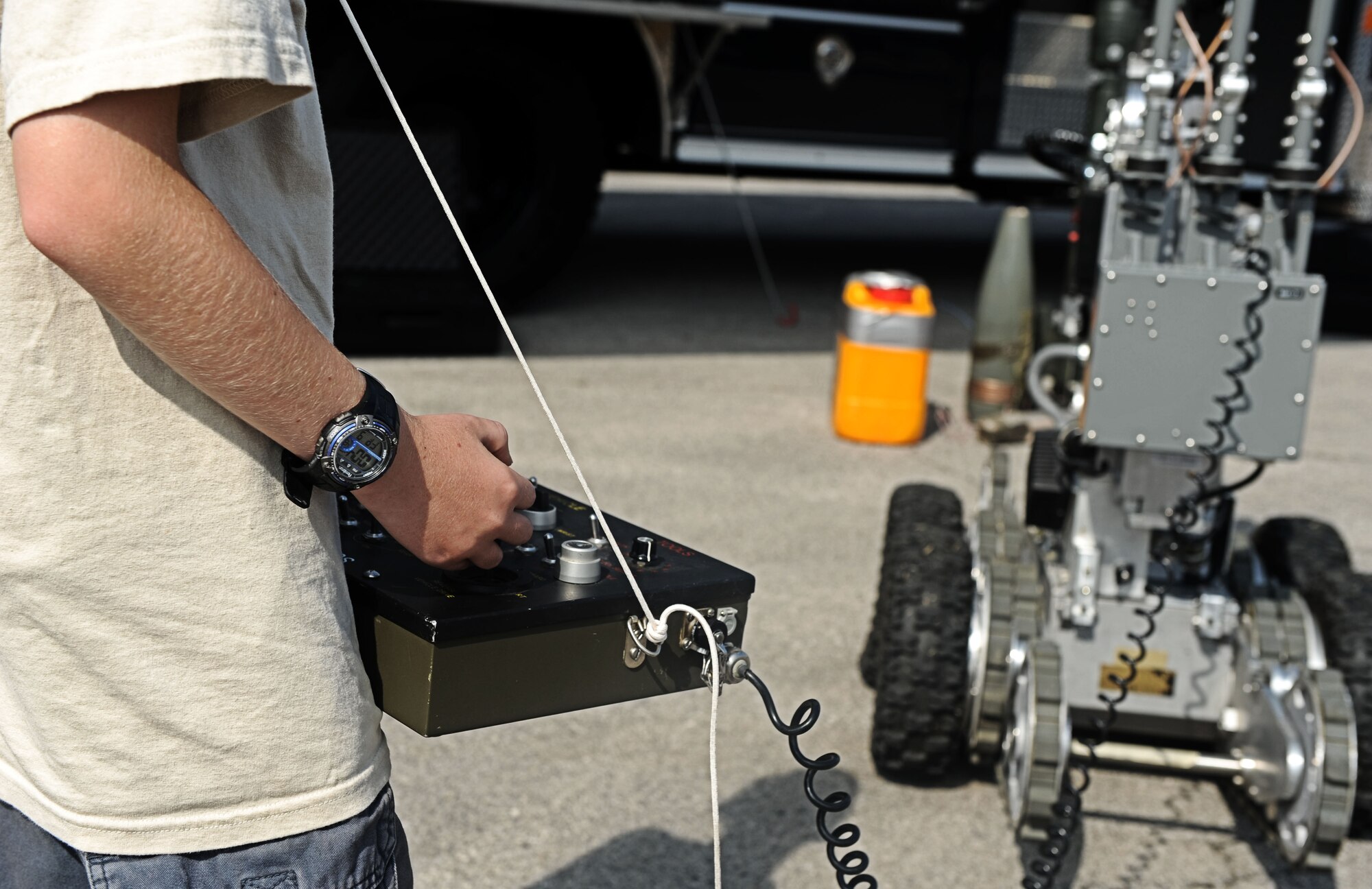 Alex Bendele, son of Chief Master Sgt. David Bendele, 375th Civil Engineer Squadron superintendent, operate the EOD robot Aug. 9, 2013 at Scott Air Force Base, Ill.  The CES hosted a back to school event for Team Scott family members to come out, observe and play with som eof the equiptment used by CE. (U.S. Air Force photo/Senior Airman Divine Cox)