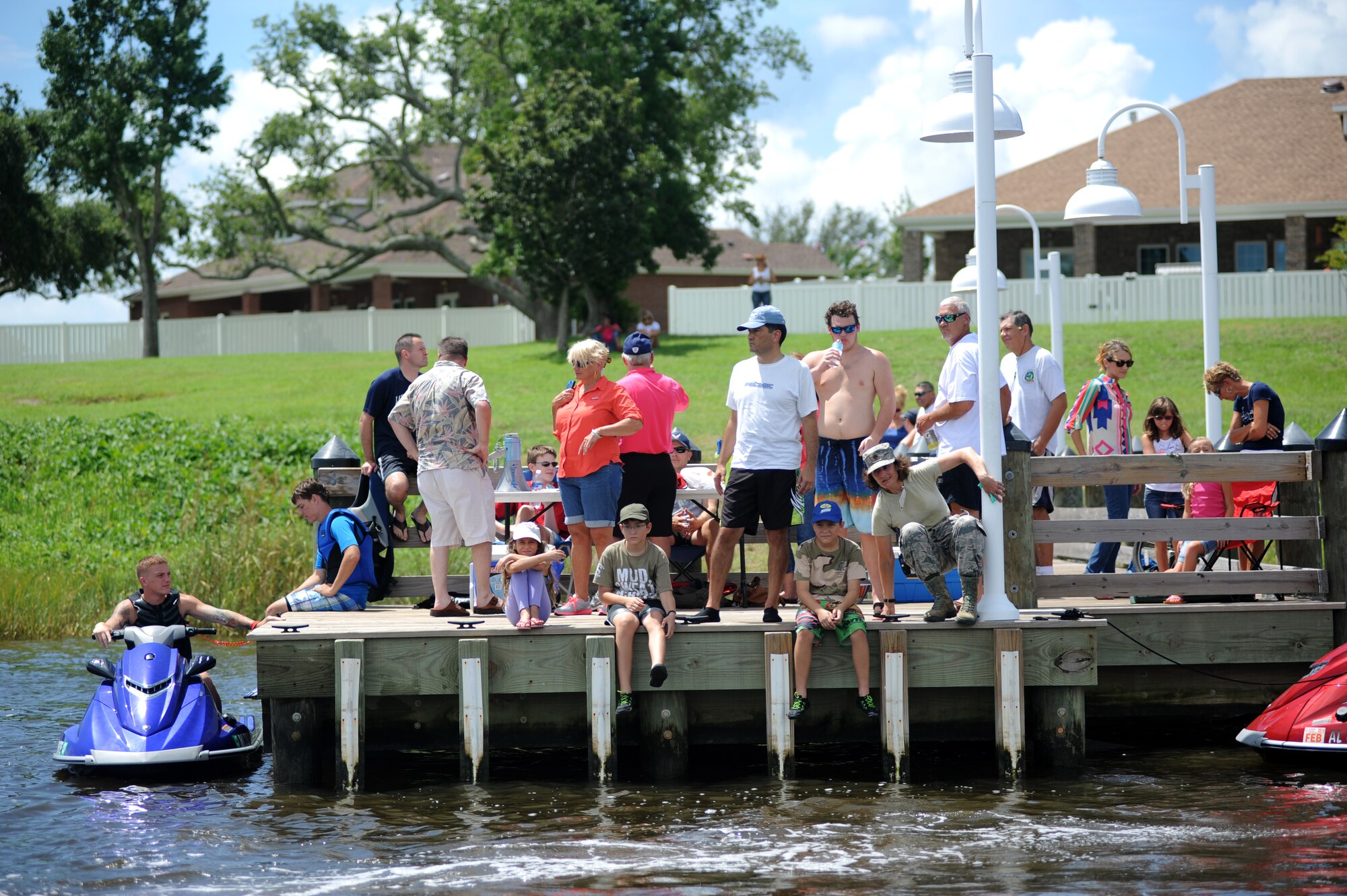 A number of spectators gathered to watch a jet ski race in the Biloxi Back Bay behind Bayridge housing, at Keesler Air Force Base, Miss., Aug. 10, 2013.  There were 10 participants in the Keesler Outdoor Recreation sponsored event.  (U.S. Air Force photo by Kemberly Groue)