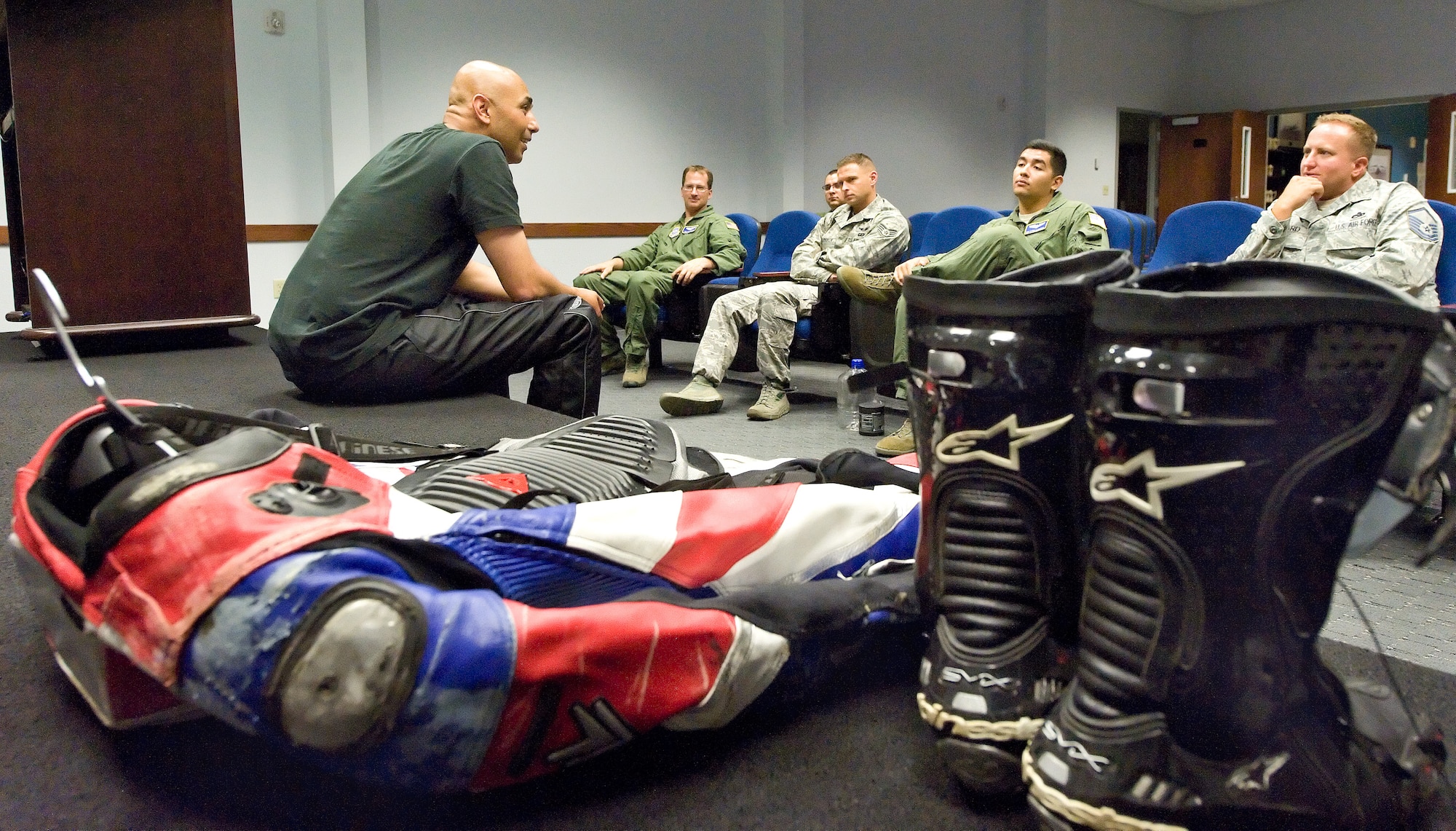 Omar Buker, Triumph Mid Atlantic Regional Manager, speaks to Team Dover motorcycle riders July 9, 2013, at Dover Air Force Base, Del. Buker, author of "Thoughts of a Rider" and Team ProMotion track coach, talked about rider safety, protective gear and technological advancements in production motorcycles. (U.S. Air Force photo/Roland Balik)