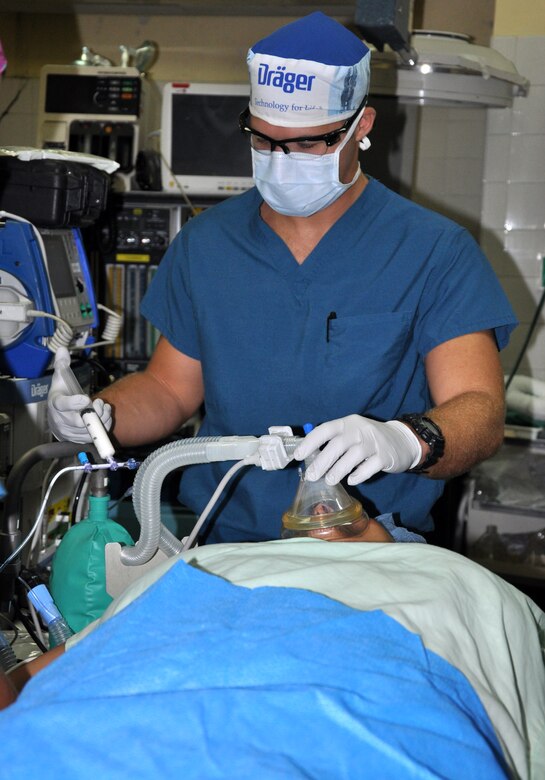 As part of a six-person mobile surgical team from Joint Task Force-Bravo U.S. Army 1st Lt. Nicholas Kroll, Medical Elements certified registered nurse anesthetist, prepares a patient for surgery Aug. 7, 2013 at a hospital in Comayagua, Honduras.  The surgical team assisted the hospital in removing three gallbladders and one bot fly larvae from a child’s body. MEDEL provides relevant, responsive care while enhancing the capabilities of partner nations. 