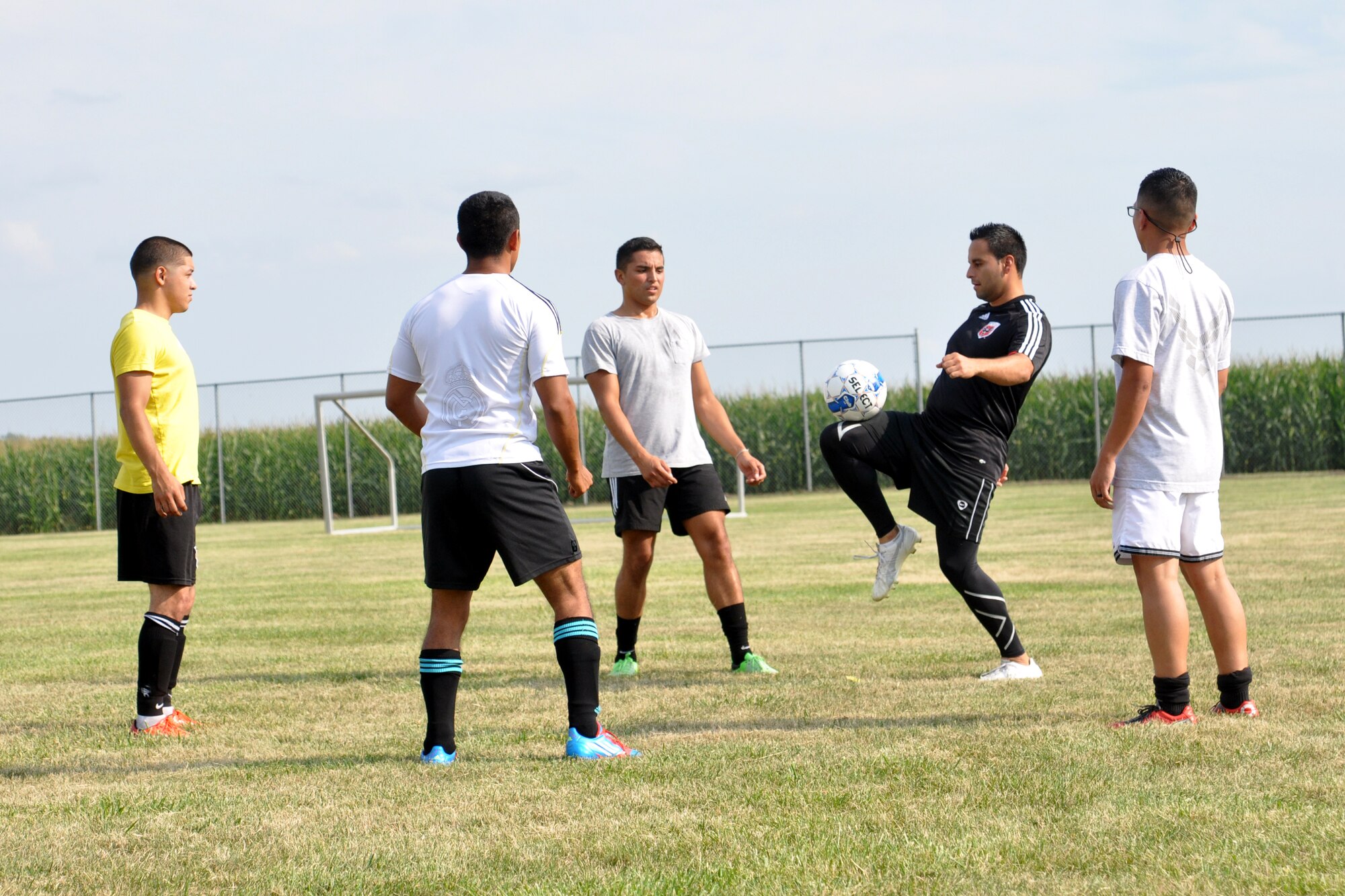 Jose Rodriguez, a U.S. Air Force staff sergeant with the 55th Aerospace Medicine Squadron, warms up prior to practice with some of his FC Offutt teammates Aug. 11 at Haworth Park in Bellevue, Neb. The club will once again head to Lackland Air Force Base, Texas, over Labor Day weekend to compete in the Defender's Cup, an annual military soccer tournament. (Photo by Ryan Hansen)