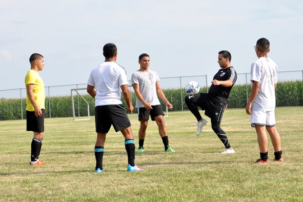 Jose Rodriguez, a U.S. Air Force staff sergeant with the 55th Aerospace Medicine Squadron, warms up prior to practice with some of his FC Offutt teammates Aug. 11 at Haworth Park in Bellevue, Neb. The club will once again head to Lackland Air Force Base, Texas, over Labor Day weekend to compete in the Defender's Cup, an annual military soccer tournament. (Photo by Ryan Hansen)