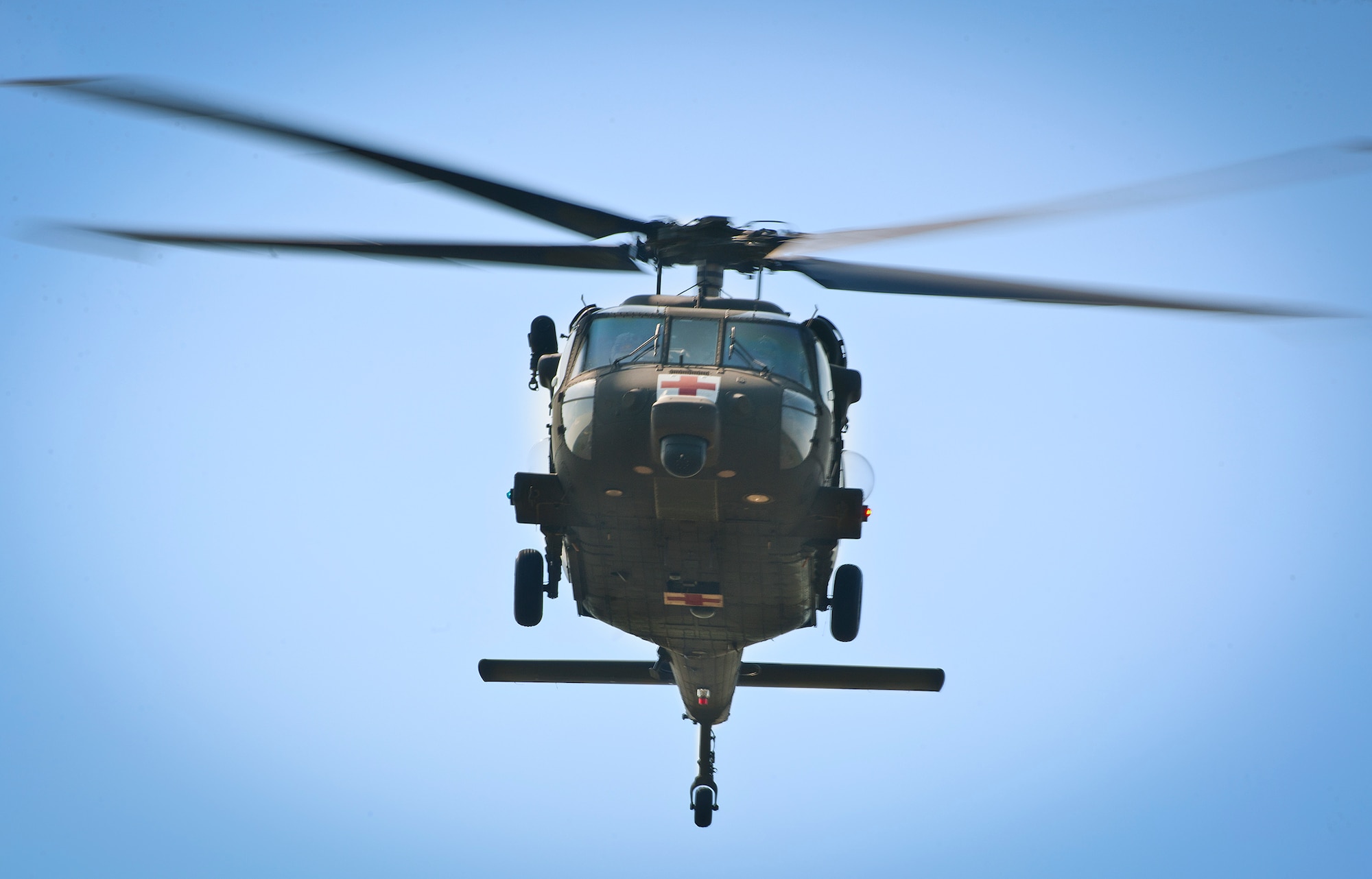 An Army UH-60 Blackhawk from the Aviation Applied Technology Directorate at Fort Eustis, Va., performs a flyby Aug. 6 while acoustic equipment on the ground records each sound it makes during the pass on the Eglin Air Force Base, Fla., range.  The sound recording was for Acoustic Week, a three-week project hosted by the 46th Test Squadron and Project Chicken Little.  The event is a cost-shared opportunity between the government and customers to collect specific and general sound data from ground and aerial vehicles.  The event began July 29 and ends Aug. 15.  (U.S. Air Force photo/Samuel King Jr.)
