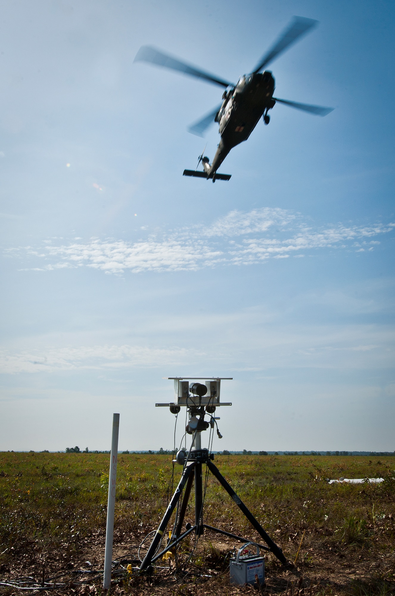 An Army UH-60 Blackhawk from the Aviation Applied Technology Directorate at Fort Eustis, Va., passes over a Navy recording device Aug. 6 during Acoustic Week at Eglin Air Force Base, Fla.  The Blackhawk passed over the sound equipment at different speeds and altitudes to provide unique acoustic variations to be recorded.  The event is a three-week project hosted by the 46th Test Squadron and Project Chicken Little.  It is a cost-shared opportunity between the government and customers to collect specific and general sound data from ground and aerial vehicles.  The event began July 29 and ends Aug. 15.  (U.S. Air Force photo/Samuel King Jr.)