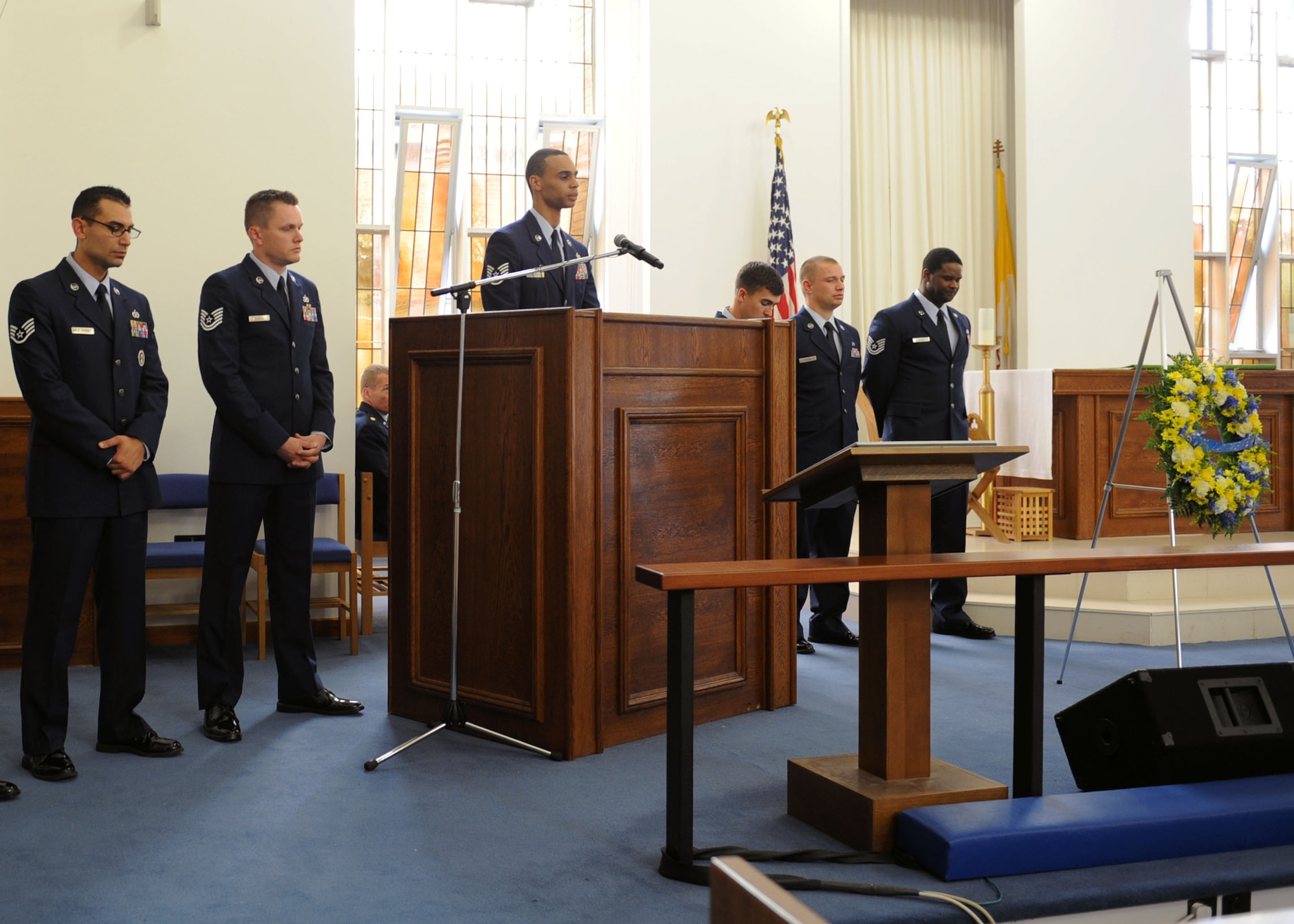 Members of the 100th Civil Engineer Squadron Electrical shop share their memories of U.S. Air Force Staff Sgt. Anderson Johnson during Johnson’s memorial service Aug. 12, 2013, at the base chapel on RAF Mildenhall, England. Johnson was killed July 28, 2013, in a motor vehicle accident. The memorial service celebrated Johnson’s life, as well as his accomplishments in the Air Force. (U.S. Air Force photo by Airman 1st Class Preston Webb/Released)
