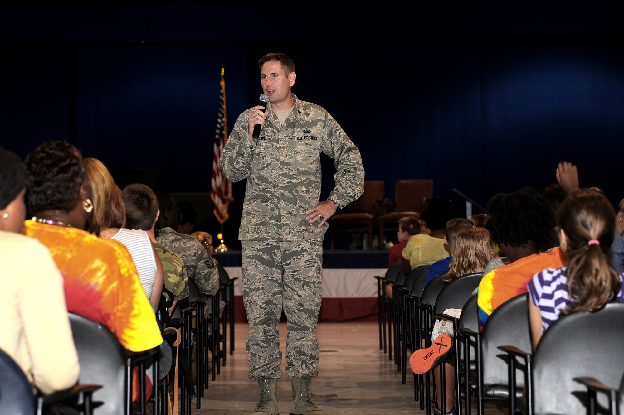 U.S. Air Force Lt. Col. Gregory Beaulieu, 633rd Force Support Squadron commander, speaks to children at the annual Operation Hero event at Langley Air Force Base, Va., Aug. 7, 2013. Operation Hero educates children about deployments by showing them a few of the pre-deployment tasks Service members accomplish. (U.S. Air Force photo by Airman 1st Class Kimberly Nagle/Released)