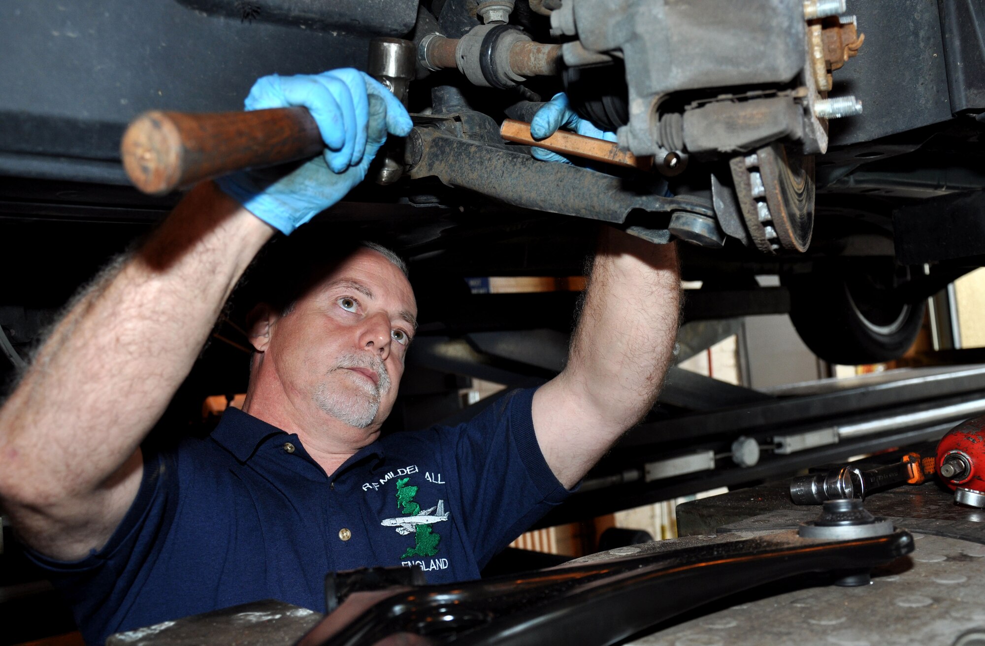 Nick Termaine, 100th Force Support Squadron mechanic, repairs a car axle Aug. 12, 2013, at the Auto Hobby Complex on RAF Mildenhall, England. The Auto Hobby Complex offers many services including classes, tool rentals, towing and trained mechanics to assist with repairs. (U.S. Air Force photo by Rebecca Grillo/Released)

Editors Note: This photo was taken by the 100th Air Refueling Wing Public Affairs Youth Employment Skills intern.
