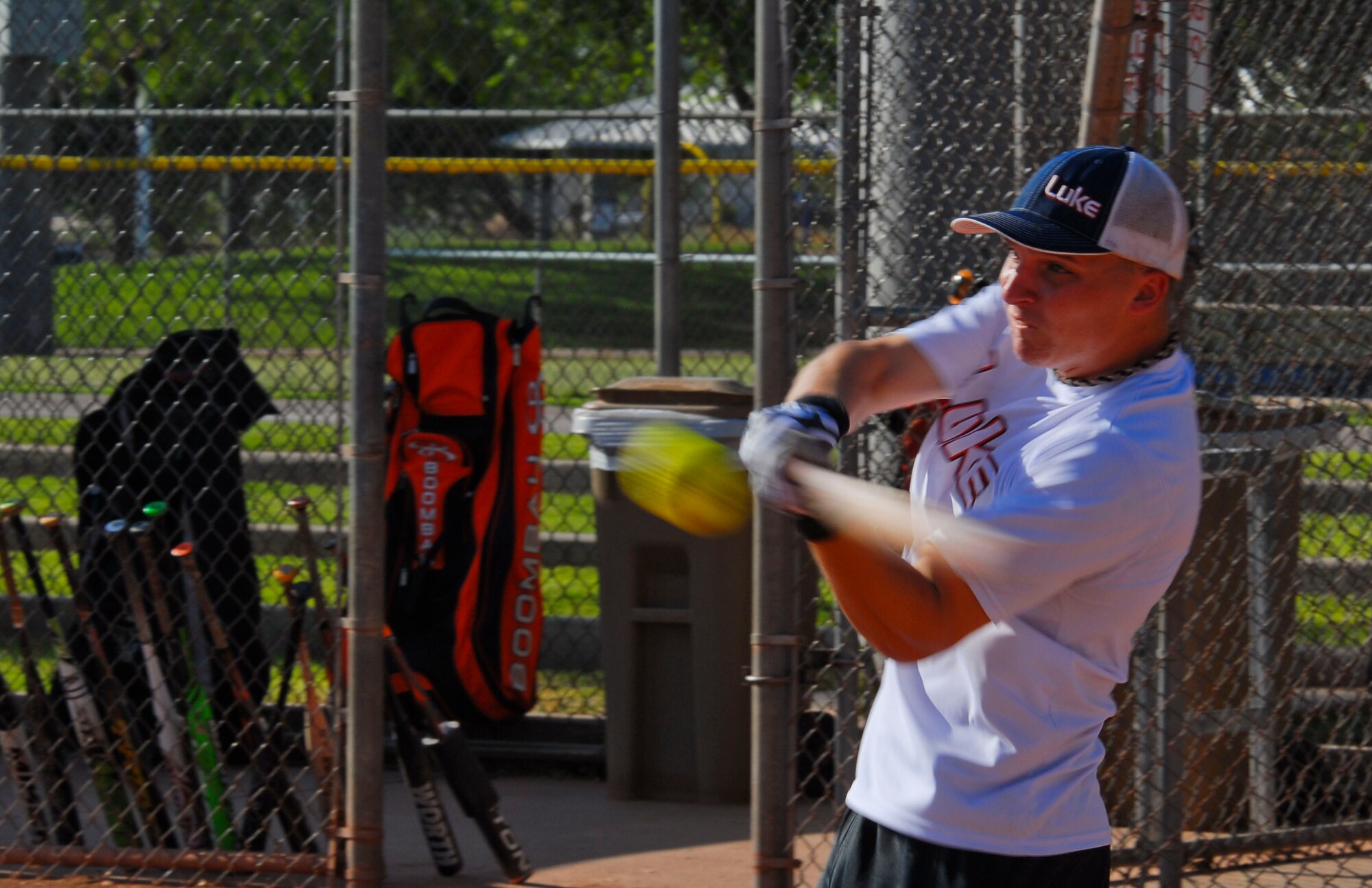 Dustin Barnes, 56th Security Forces Squadron, hits the softball in the second inning of the game against the Mesa Police Department Aug. 3 during the Goodyear Guns vs. Hoses softball tournament at the Goodyear City Park baseball field. (U.S. Air Force photo/Senior Airman David Owsianka)