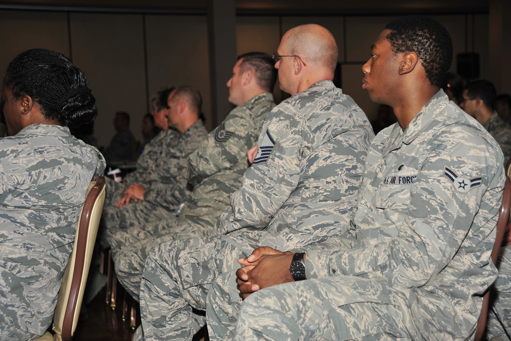 U.S. Air Force Airmen listen attentively as Tania Glenn, Doctor of Psychology and Licensed Clinical Social Worker, delivers a feelings-free, scientific analysis of the human body’s physiological response to high-stress situations during a briefing at the Landing Zone at Cannon Air Force Base, N.M., Aug. 5, 2013. Glenn, who specializes in Post-Traumatic Stress Disorder in members of the armed forces and first responders, described the chemical reactions that take place within the body when it comes under extreme stress or strain. (U.S. Air Force photo/Senior Airman Whitney Tucker)
