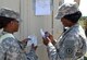 Spc. Marsha Feightner and Spc. Antoinette Wright, transportation document specialists for the 689th Rapid Port Opening Element from Joint Base Langley-Eustis, Va., double-check container paperwork ensuring the right equipment is in the right place at the forward distribution node supporting Operation Gateway Relief. (Courtesy photo/Released)