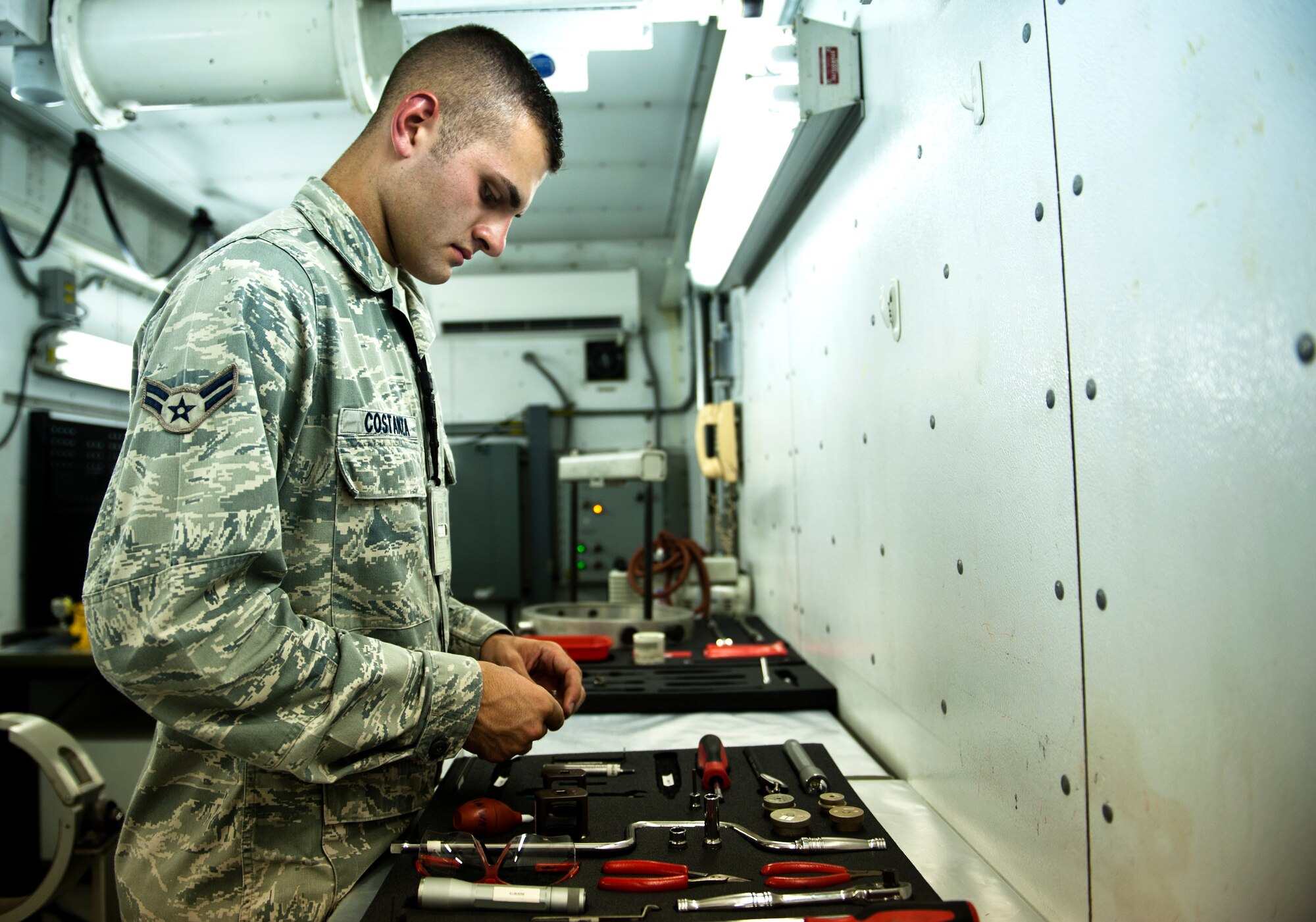 Airman 1st Class Giovanni Costanza, 39th Maintenance Squadron technician, organizes tools for work Aug. 2, 2013, at Incirlik Air Base, Turkey. With the wide array of tools Costanza uses, it can take up to two and a half hours of preparation time prior to performing maintenance. (U.S. Air Force photo by Senior Airman Daniel Phelps/Released)